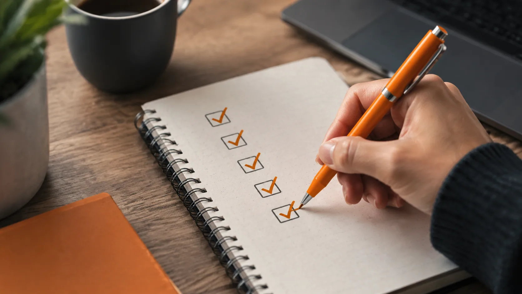Notebook displaying sequential steps for launching an affiliate business