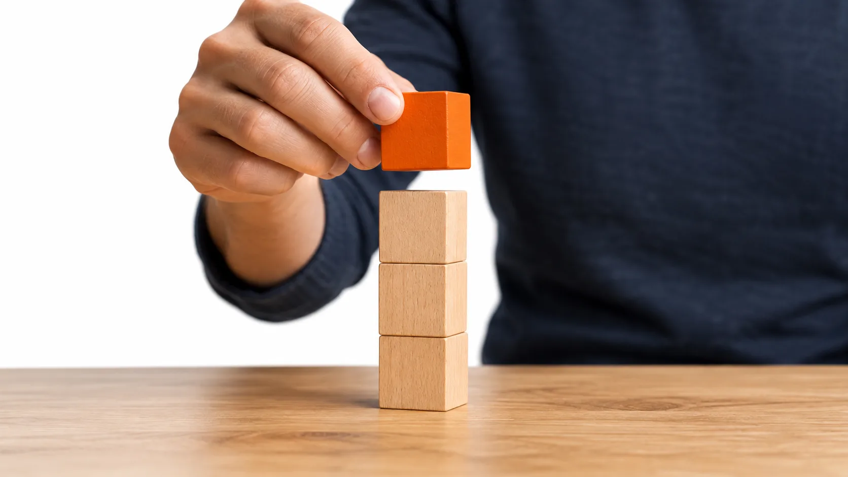 Stacking blocks one by one to represent starting simply with marketing automation